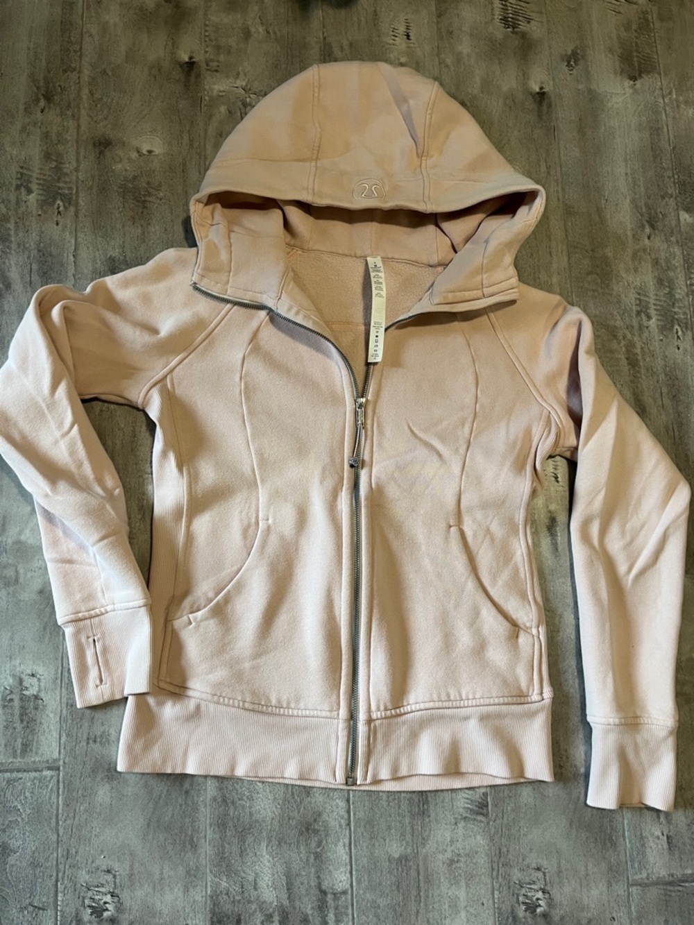 lululemon pastel pink zip-up hoodie with embroidered logo